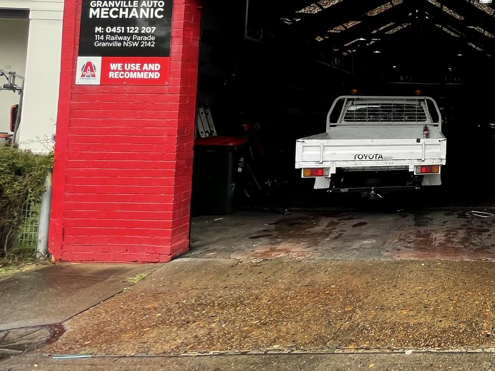 Service bay at Granville Auto Mechanic with a ute on the hoist